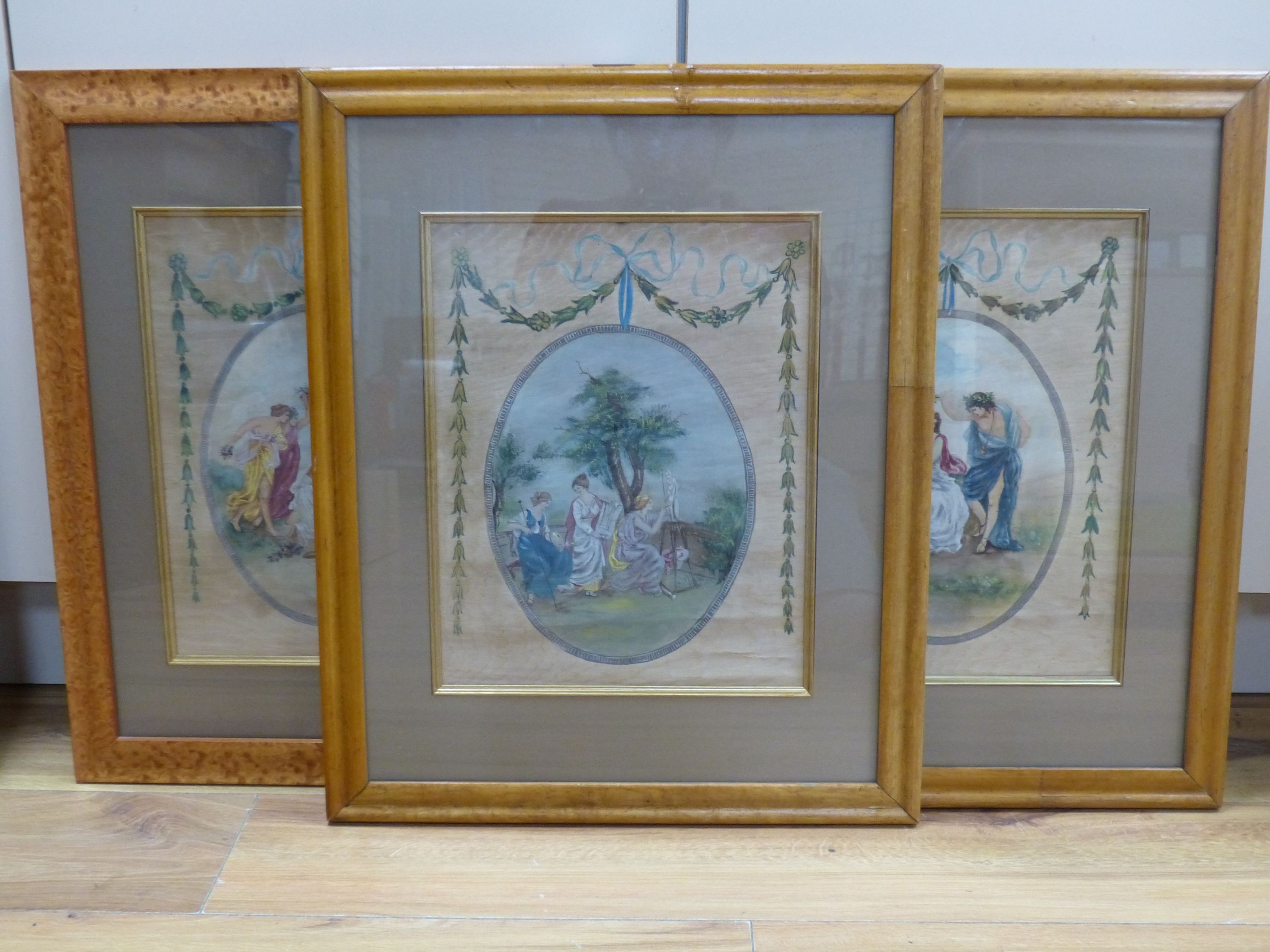 A set of three Edwardian painted silk panels depicting classical muses, 35 x 27cm